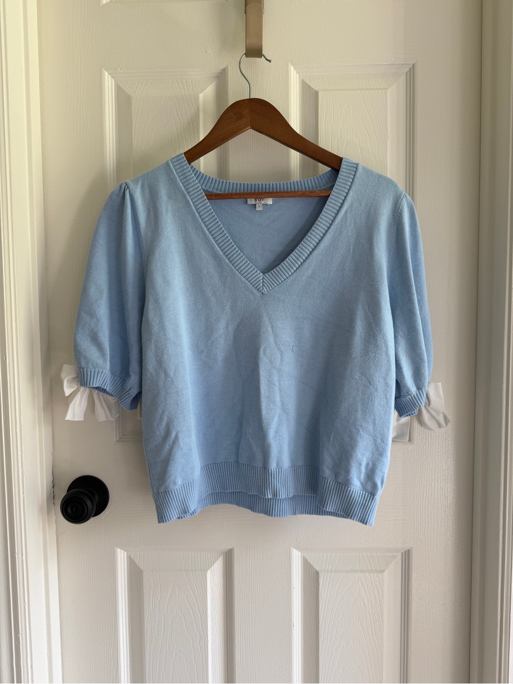 Womenโs Light Blue V-Neck Puff Sleeve Sweater with Bow Cuffs